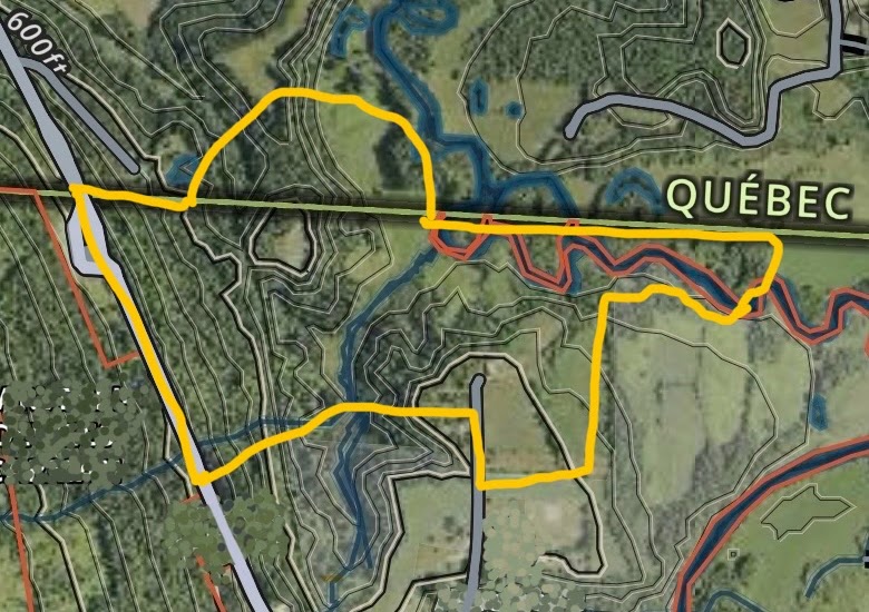 Survey map of the parcel outlined in yellow, straddling the Vermont–Québec border